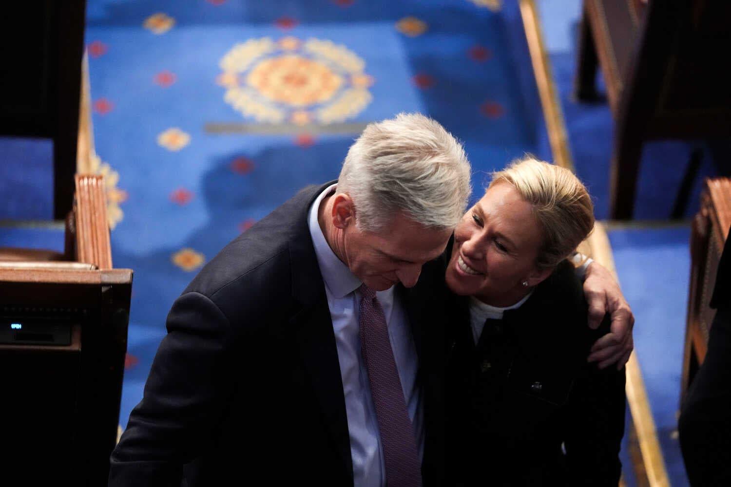 Representatives Kevin McCarthy and Marjorie Taylor Greene embracing at the Capitol.