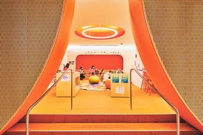 The Adams Street Library in Dumbo, Brooklyn, has a children’s space with hues reminiscent of a Creamsicle.