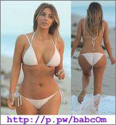 kim   kardashian wearing a bikini at a beach in mi