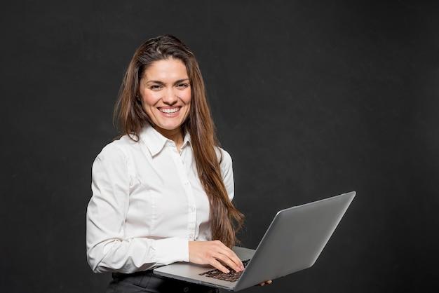 Front view young woman with laptop