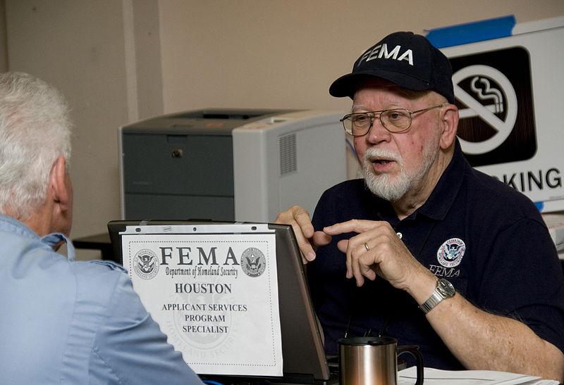 File:FEMA - 40779 - FEMA Individual Assistant specialist speaks with a resident at the Fargo DRC.jpg