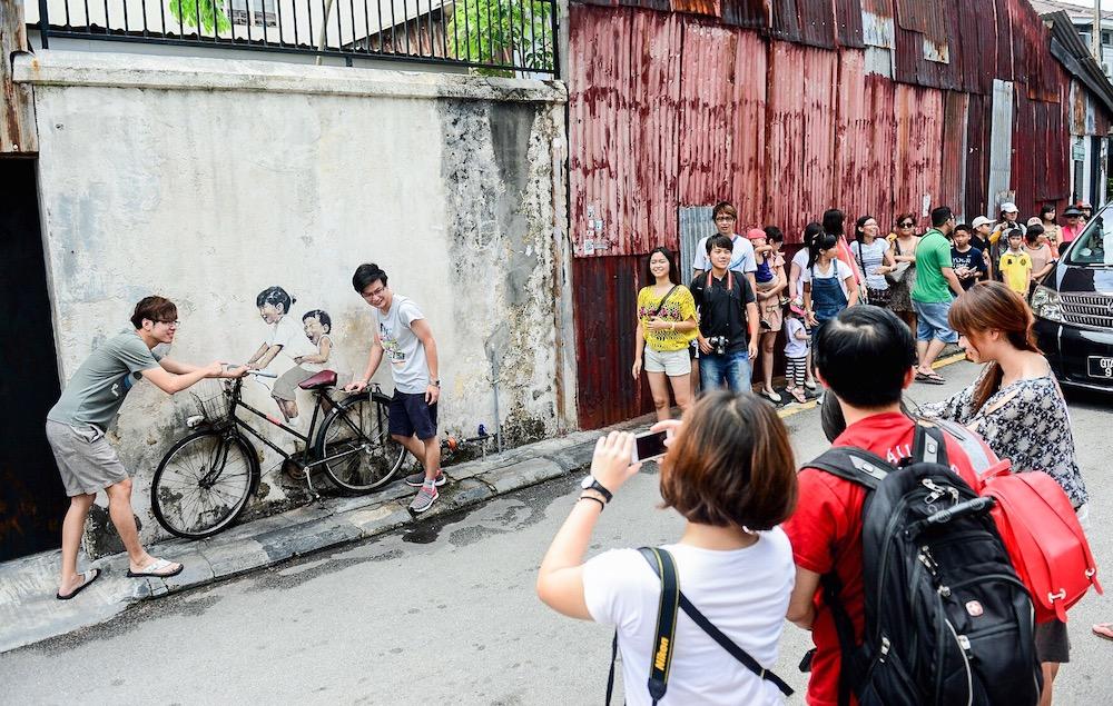 Ernest Zacharevic blames his art for turning once-quiet heritage street in Penang into 'circus' | Malay Mail