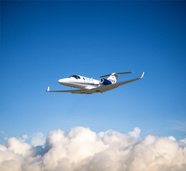 A Citation M2 Private Jet flying through the skies.