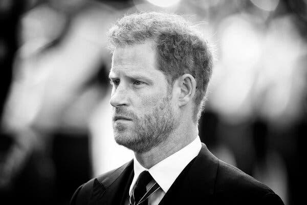 A black-and-white photograph of Prince Harry looking mournful at Queen Elizabeth’s funeral. It is a close-up of his face, with everything behind it blurred.
