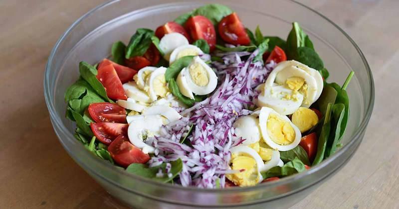 You can make your own hot bacon salad dressing for this hearty spinach salad.