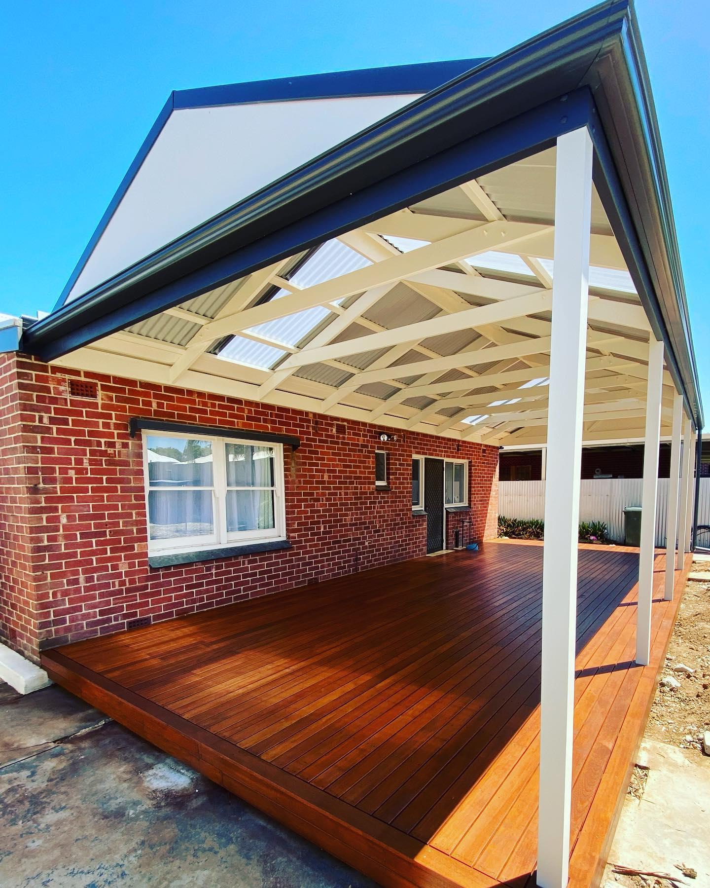 A beautifully crafted outdoor space with a spacious timber deck that blends seamlessly with the natural surroundings, showcasing the premium decking craftsmanship of Superb Pergolas N Decks in Adelaide.