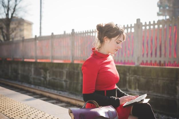 young beautiful red dressed vintage hipster woman