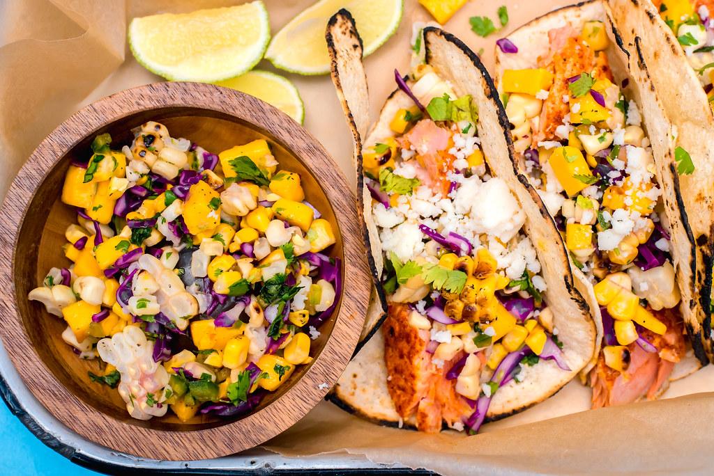 A bright and colorful salsa, filled with sweet corn, fruity mango and spicy jalapenos is the perfect addition to fish tacos.