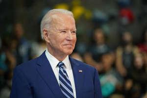 Joe Biden wearing a suit and tie: President Joe Biden waits to speak as he visits the Sportrock Climbing Centers in Alexandria, Virginia on May 28, 2021. Biden's proposed budget would increase spending to equal 25 percent of U.S. economy.