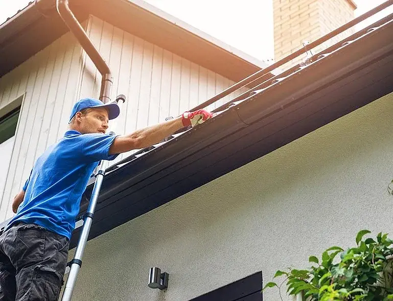 professional-gutter-cleaning-on-ladder-1024x675.jpg