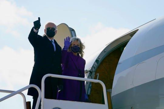 President-elect Joe Biden and his wife, Jill Biden, board a plane at New Castle Airport, Tuesday, Jan. 19, 2021, in New Castle, Delaware.