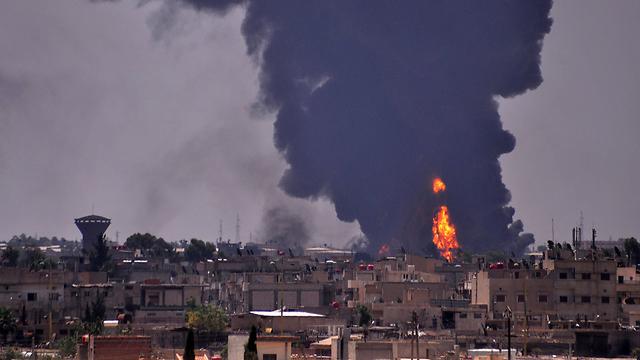 Smoke rises from an Islamic State attack in Hasaka. (Photo: AFP)