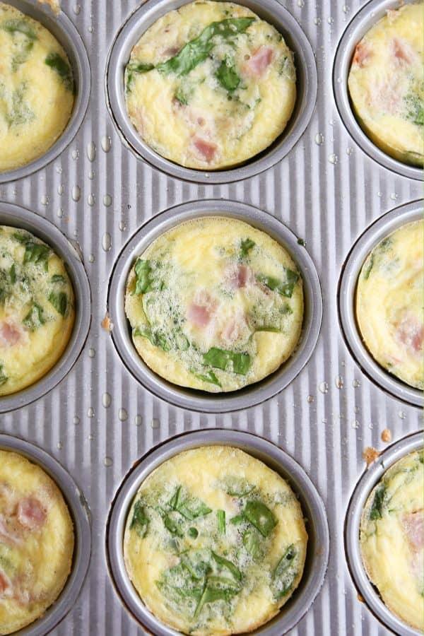 Healthy egg and veggie muffins in muffin tin.