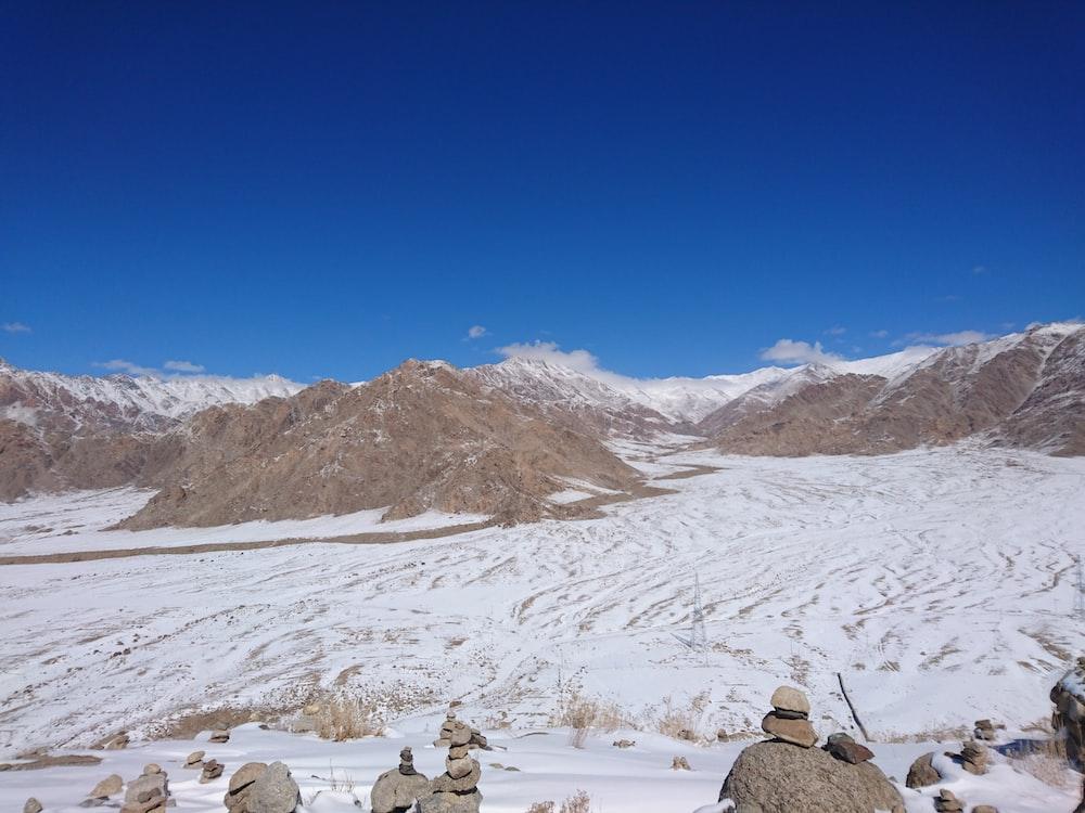people walking on snow covered field during daytime