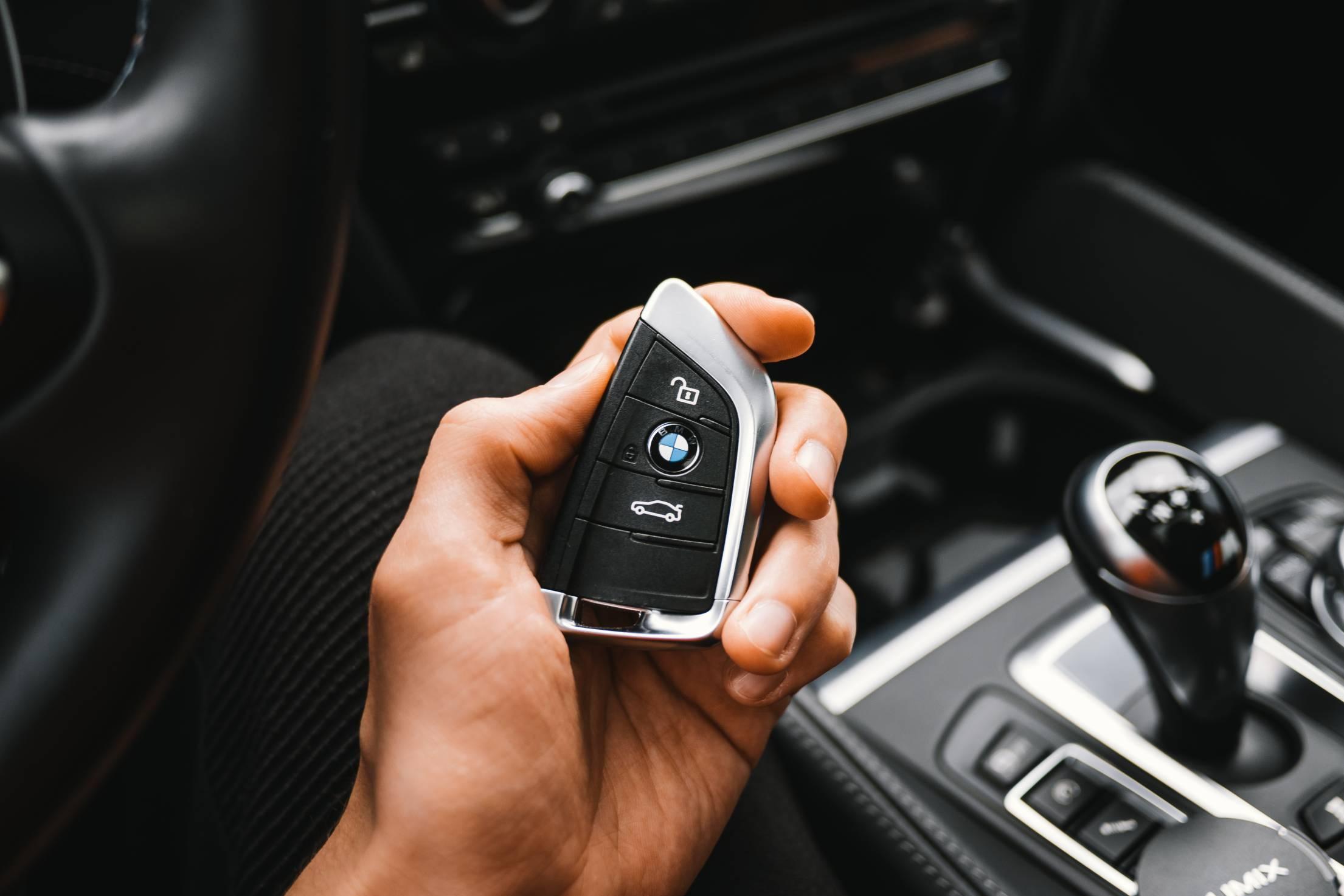 Man Holding a BMW M Sport Car Key | Free Car Photo by picjumbo