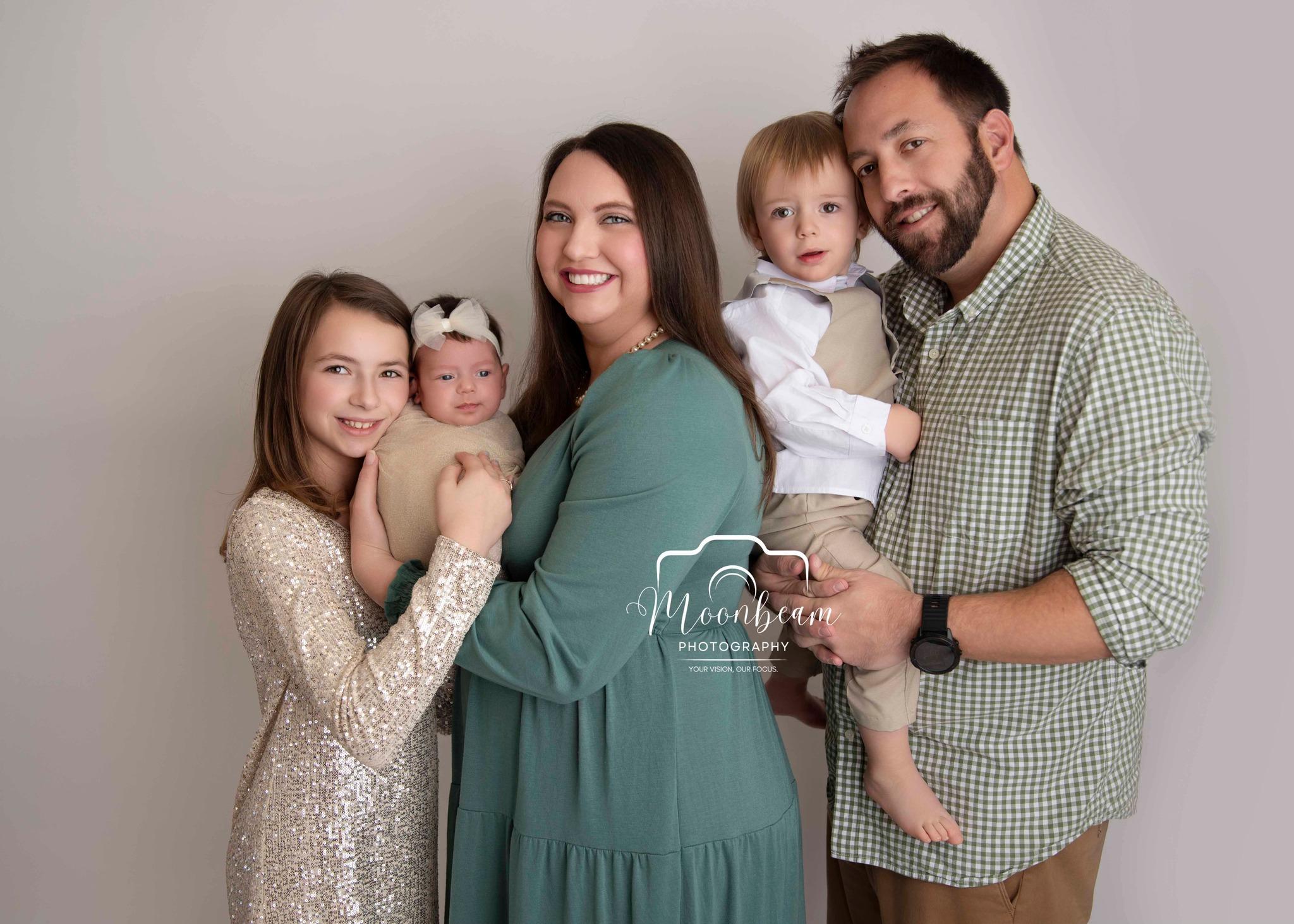 May be an image of 4 people and baby