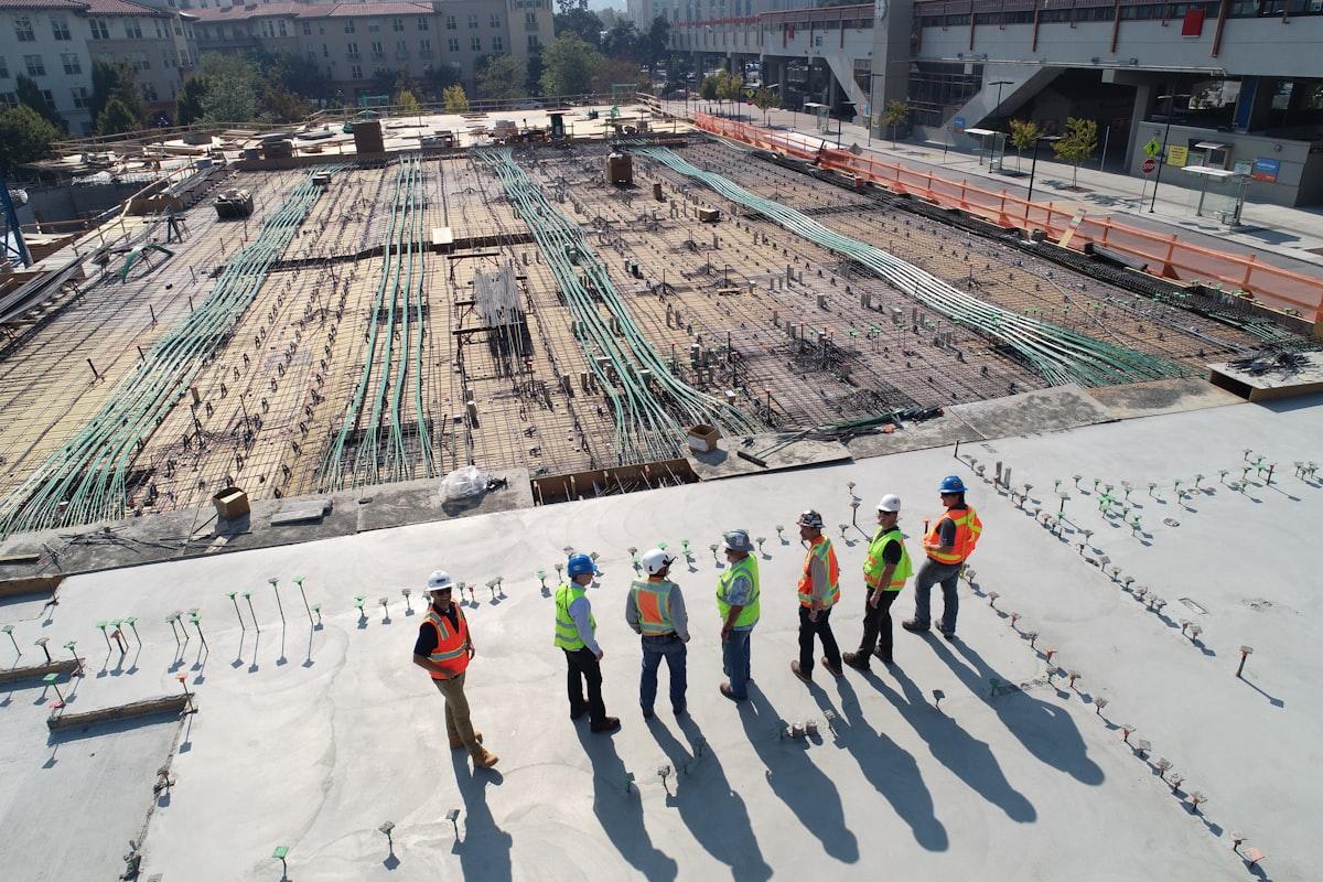 General contractor reviewing blueprints on a residential construction site