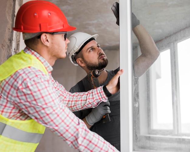 Medium shot man holding drill