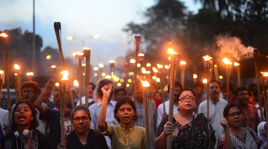 Bangladeshi secular activists take part in a torch-lit protest against the killing of blogger Niloy Chakrabarti, who used the pen-name Niloy Neel, in Dhaka on August 8, 2015. © Munir uz Zaman