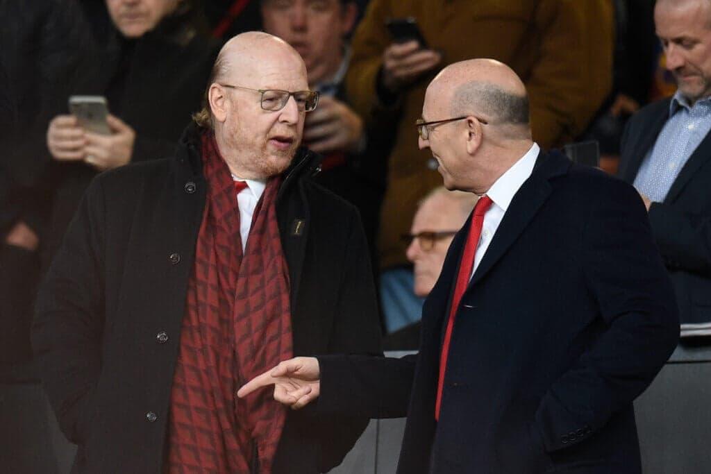 Avram (L) and Joel Glazer talk before the UEFA Champions league first leg quarter-final football match between Manchester United and Barcelona at Old Trafford in Manchester, north west England, on April 10, 2019. (Photo by Oli SCARFF / AFP) (Photo credit should read OLI SCARFF/AFP via Getty Images)