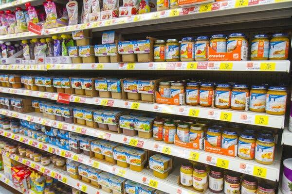 Rows of baby food on shelves in a Wal-Mart store.