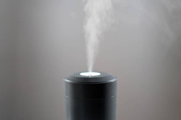 Vapor coming from electric air humidifier. Vapor coming from electric air humidifier.  ultrasonic spraying  stock pictures, royalty-free photos & images