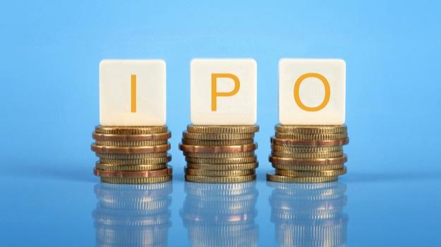IPO in letters on top of coin stacks