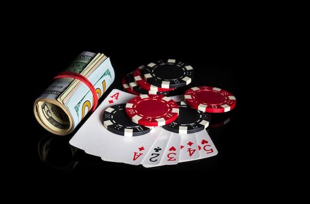 Photo high card cards combination and dollars and chips winning combination at a poker club or casino