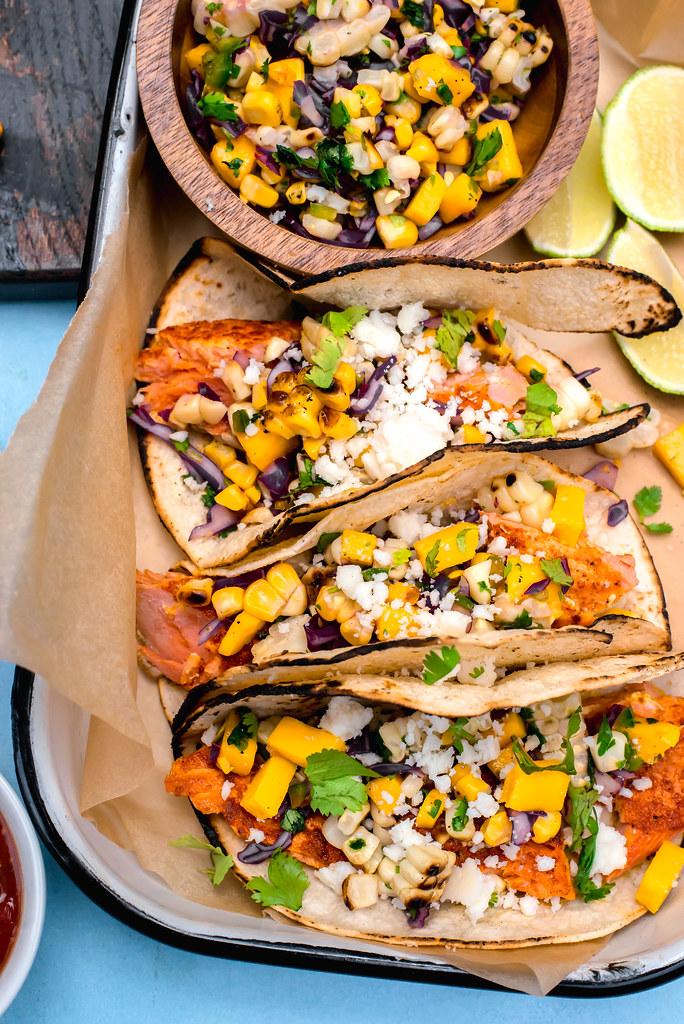 Sazon Spiced Salmon Tacos topped with a bright and colorful Mango Corn Salsa is the perfect summer dinner.