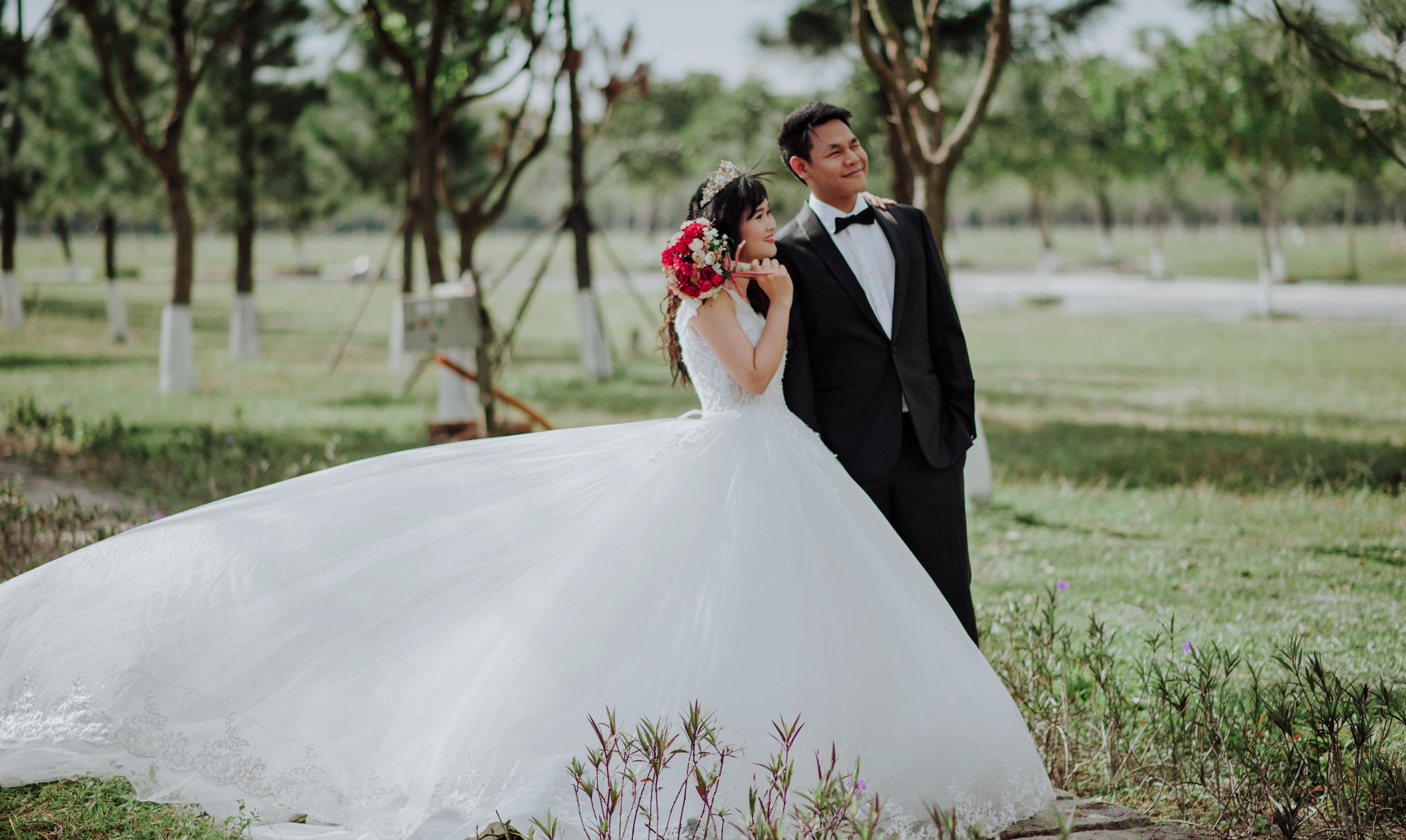 Newly Wed Couple Surrounded by Trees