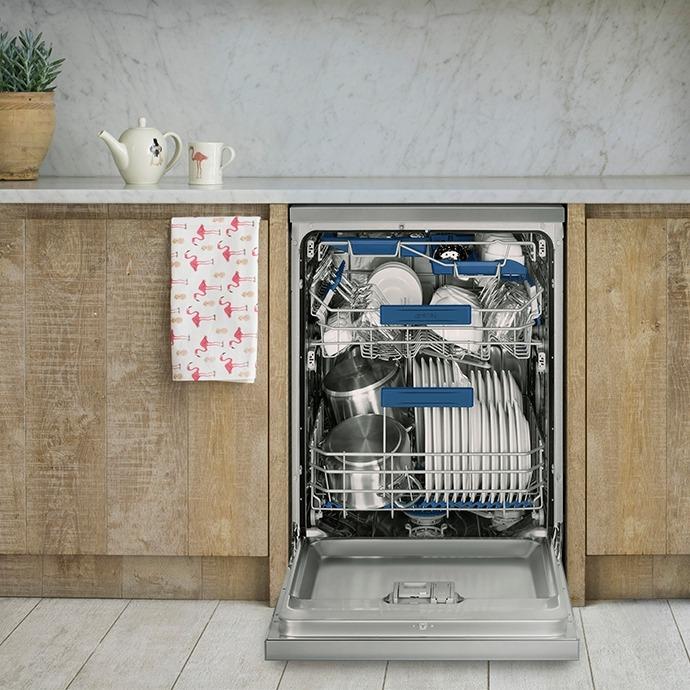 Smeg Diamond Series Dishwasher loaded with dishes in it, showcasing its premium design and advanced features.