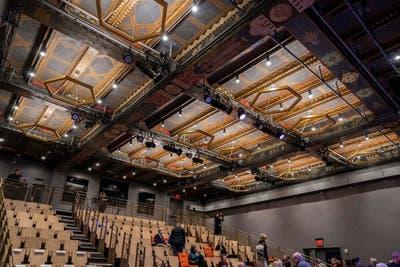 The newly renovated Buttenwieser Hall is now a black box theater but it retains its original beamed ceiling, painted with murals.