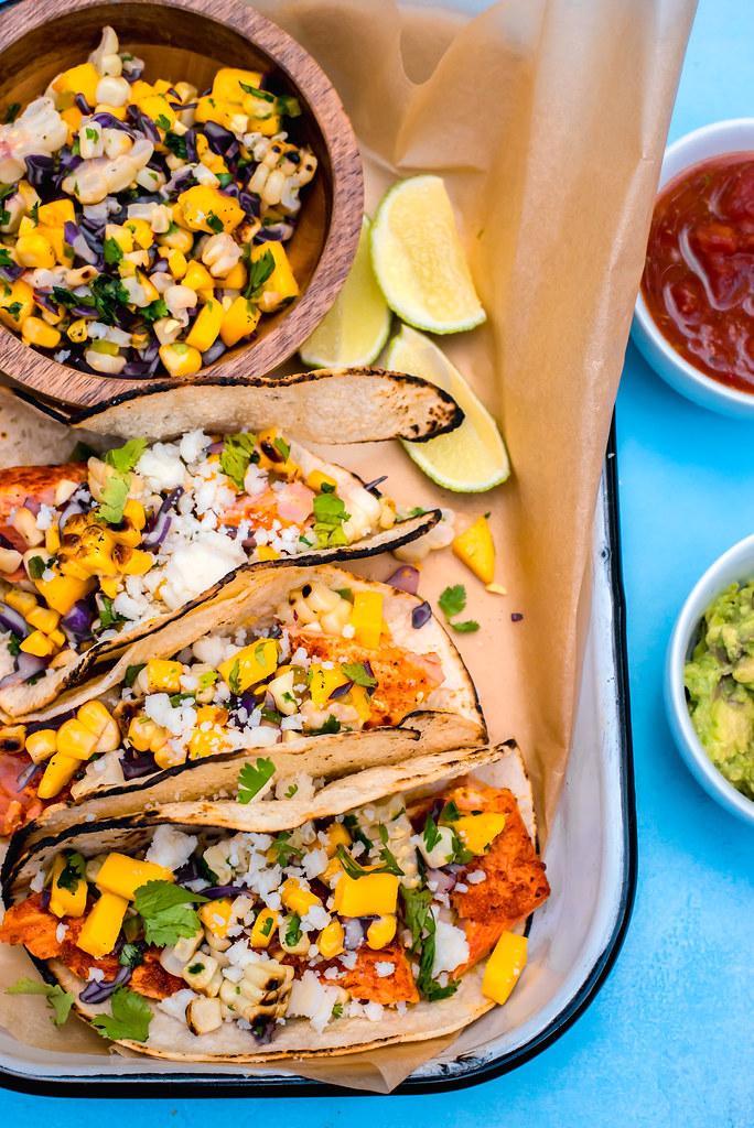 Sazon Spiced Salmon Tacos topped with a bright and colorful Mango Corn Salsa is the perfect summer dinner.