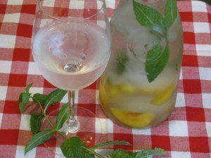 Photo: Cooling Peach Mint Water- 0 calories ~Frisky  When it is hot outside, and I mean HOT you need something that will cool you off, Mint does just that! Plus water naturally cools you off, like free air conditioning, and suppresses your appetite to help you lose weight just like the peaches in this recipe. Can you think of anything better than to sit outside reading a book with some Peach Mint water? I feel relaxed just thinking about it.  This combo is light and refreshing, if you prefer it sweeter drop a couple peach slices into your cup it really intensifies the peach flavor, you can also add a splash of vanilla  to add sweetness to the pitcher as well.  I use frozen peaches, the slicing, pitting and removing of the skins it too labor intensive for me, if you choose to use fresh peaches do all that, place in bag and freeze before making this.  Makes 1 pitcher refill up to 8 times  1 long sprig of Mint, or a handful of leaves you can tie together with kitchen twine  10 frozen Peach Slices, plus more to garnish (optional)  Water and Ice  I found that leaving the mint leaves on the sprig was easier and I got less debris in my drink that way too.  Drop peaches in your pitcher, then the mint, top with ice and water and place in fridge for 4 hours or overnight. Serve in a wine glass*, garnish with a frozen peach slice (also acts as a ice cube) you can refill the pitcher up to 8 times, or until the flavor dissipates. ~frisky