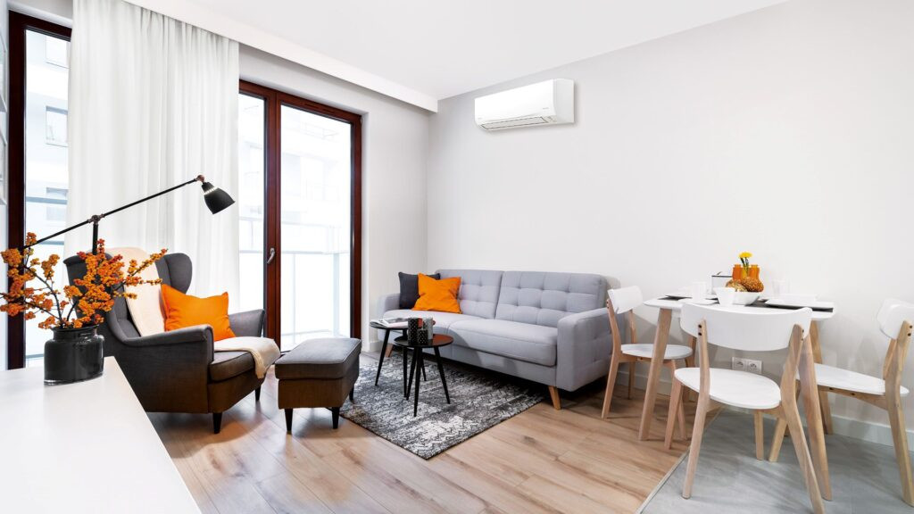A modern living room with a sleek split system air conditioner in Adelaide, providing efficient cooling and heating for year-round comfort.