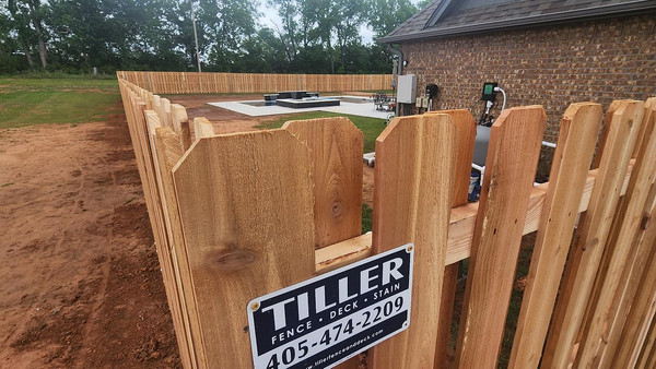 Wooden Fence Installation by Tiller Fence and Deck