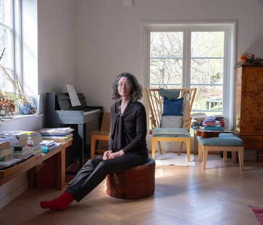 Isabelle Letellier, a French climate activist and university lecturer in Stockholm, poses for a portrait in the living room of the house she shares with her partner and their two sons in a neighborhood in western Stockholm.