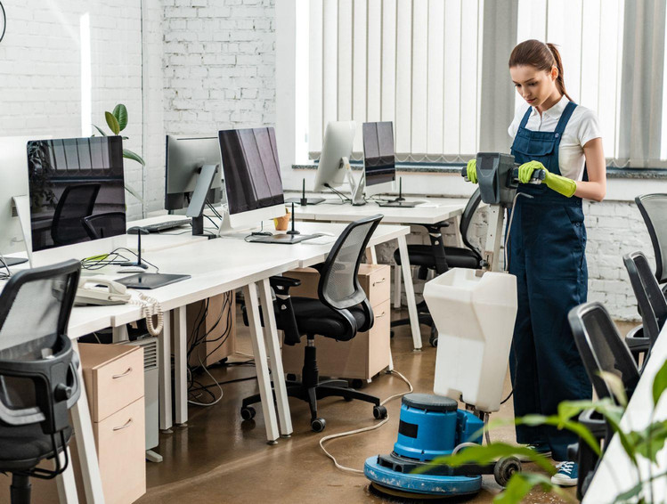 youngcleanerwashingfloorinopenspaceoffice.jpg