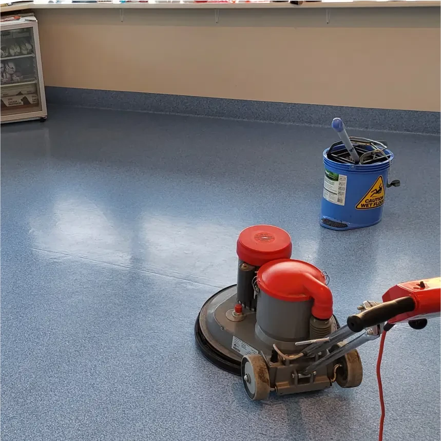 A spotless, polished commercial floor being cleaned with a professional floor scrubber, showcasing the effectiveness of Commercial Floor Cleaning by Platinum Clean Adelaide.