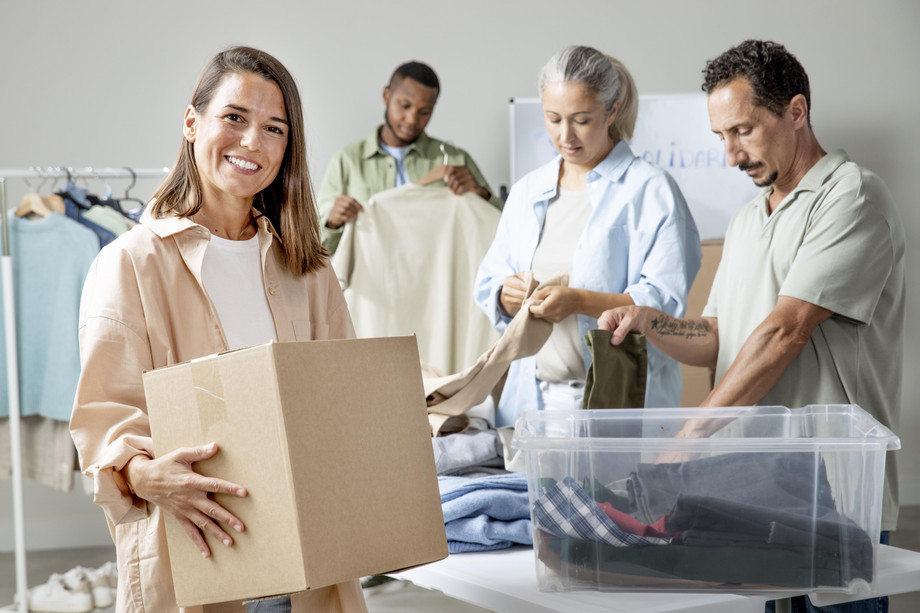 mediumshotpeoplecollectingclothes.jpg
