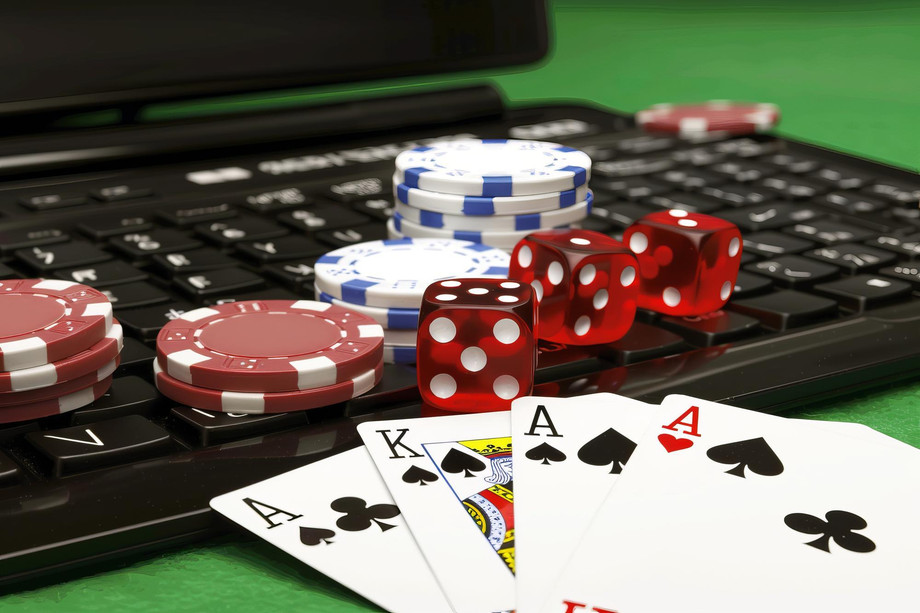 onlinegamblingconceptwithpokerchipsdiceplayingcardslaptopkeyboardvibrantfunstyledemonstratingdigitalgamblingusefulcasinowebsitesgamblingblogsgenerativeai_12690982840.jpg