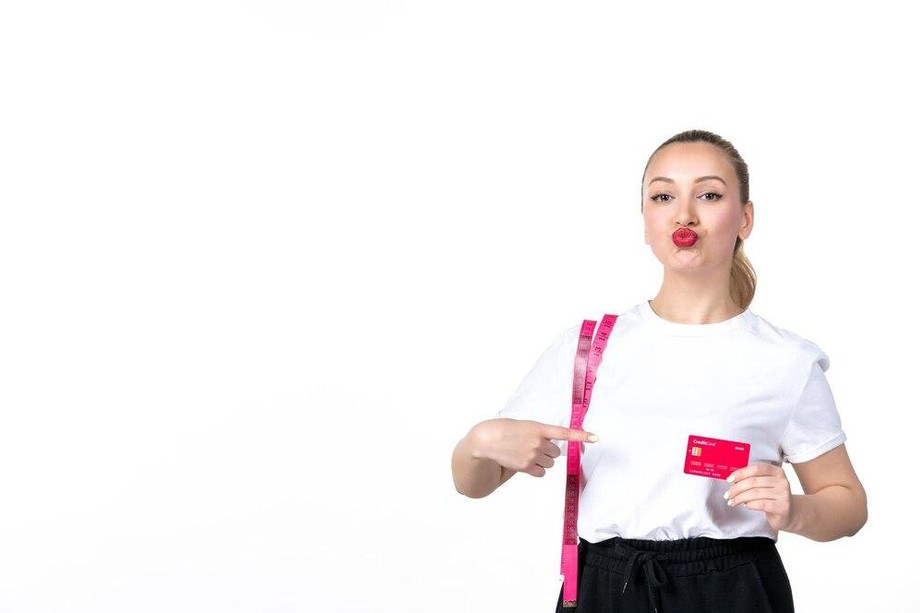 frontviewyoungwomanwithmeasuretapecreditcardwhitebackgroundmoneylosingskintorsobeautyhipmeasuringbankbodyslimmingcolour_140725155462.jpg