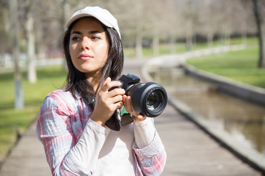 pensivefocusedphotographershootinglandmarks.jpg