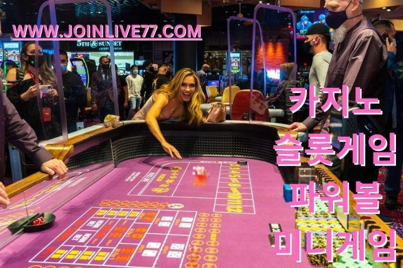 Girl casino player roll a red dice in pink casino table games
