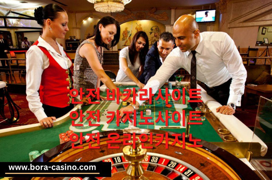 Young Professional casino dealer assisting the betting gamblers