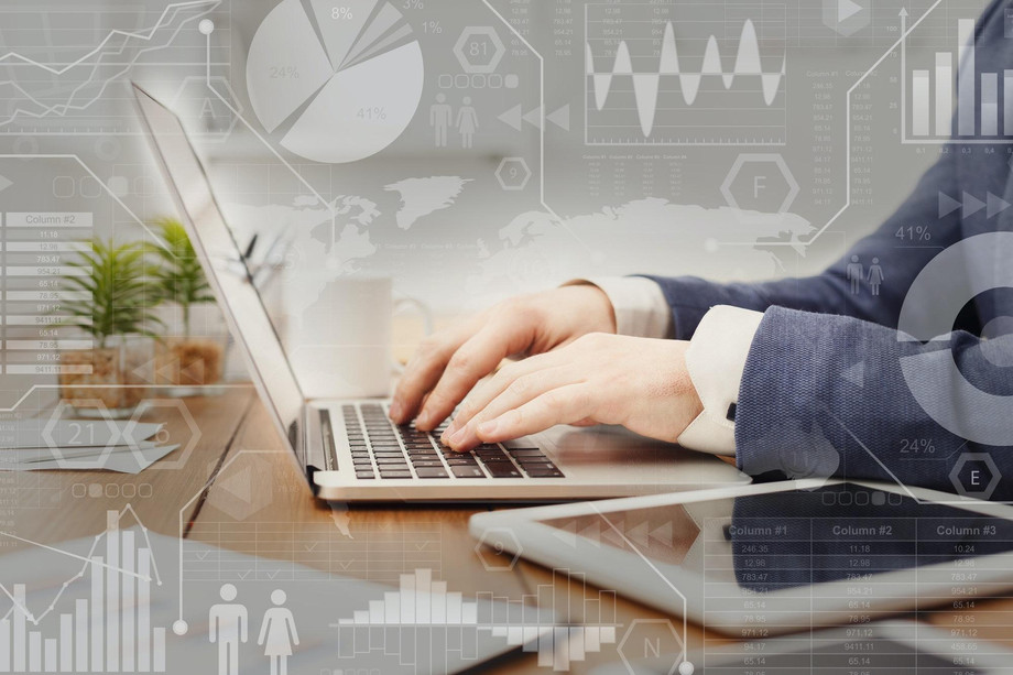 digitalmarketinginteractivescreenwithbusinessprocessesoverbusinessmantypingonlaptop.jpeg