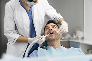 dentistdoingcheckuppatient.jpg