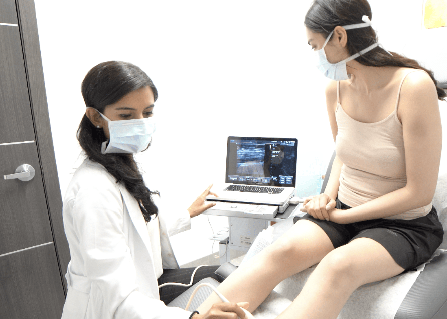 doctortreatingapatientatveintreatmentclinic.png