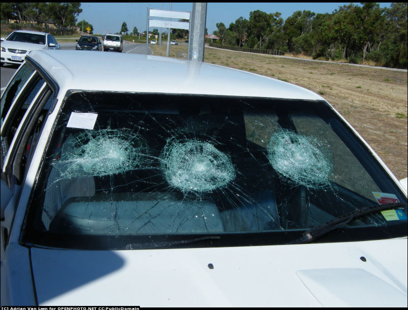 all_glass_broken_wagon_vehicle_on_the_road_large.jpg