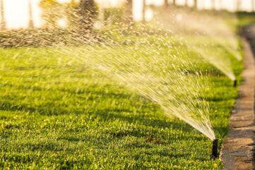sprinklers-watering-the-grass.jpg